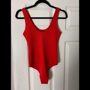 Red bodysuit jersey material.